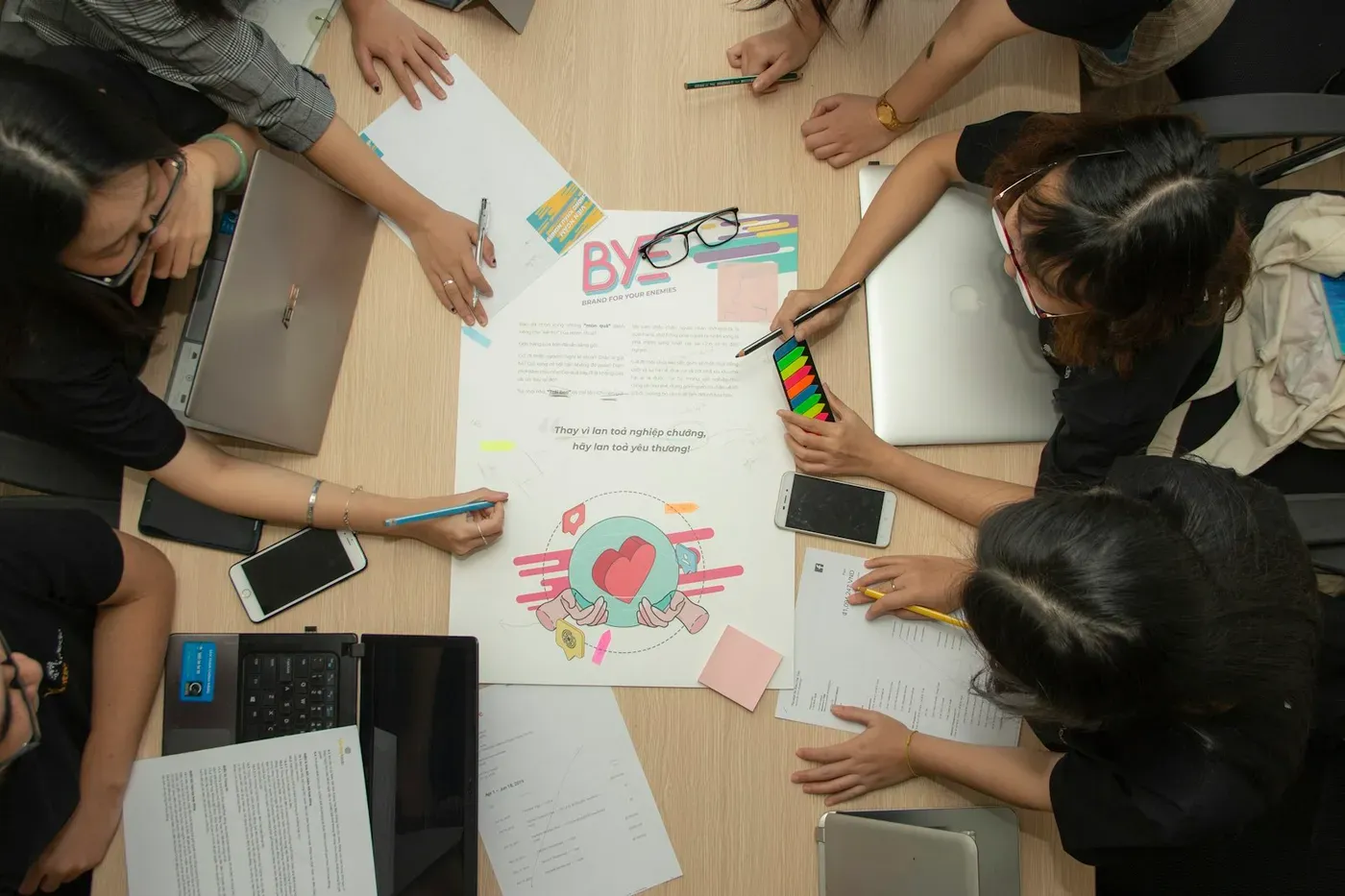 A team working together around a table during a training workshop